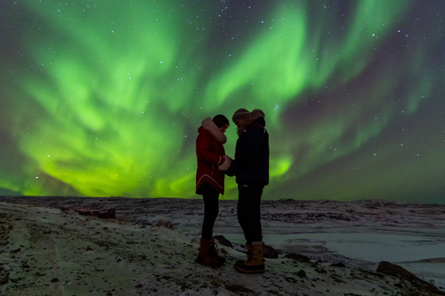 Jenna Jenkins and Chris Voss experiencing the Northern Lights in Nunavut
