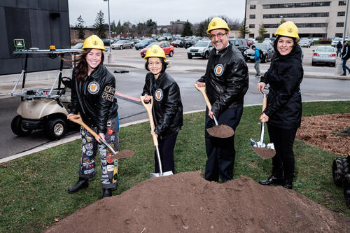 Pearl Sullivan, second from left, participates in the ground breaking ceremony for Engineering 7 with engineering students and University of Waterloo President Feridun Hamdullahpur, second from right.   