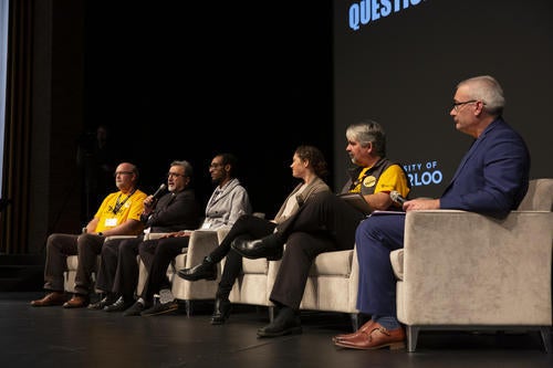 Feridun and others share the stage at the student mental health forum in 2018.