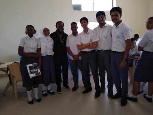Christopher Taylor with six high shcool students