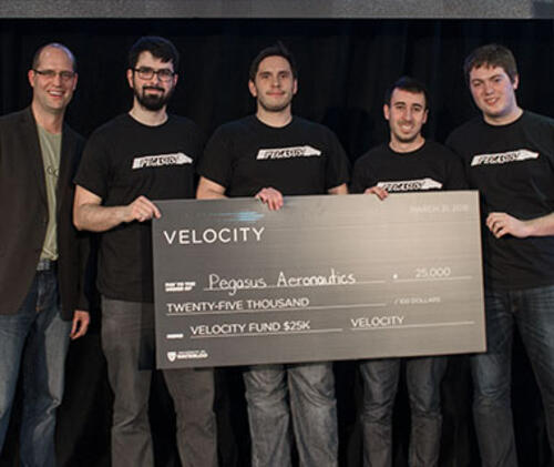 Pegasus recieve their winning $25k cheque from Mike Kirkup, director of Velocity.
