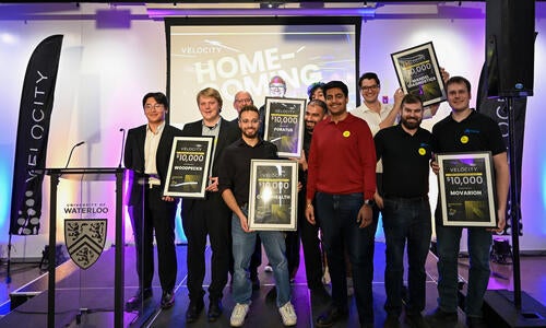 Momentum Grant recipients pose on stage together