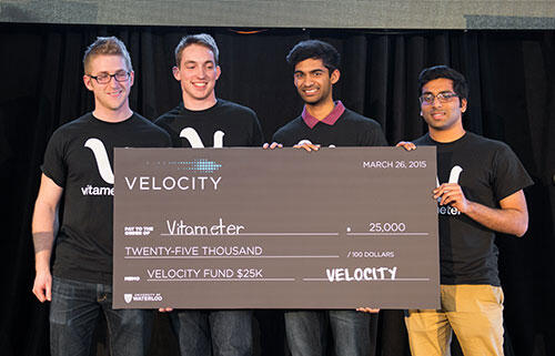 The four founders of Vitameter hold a big cheque.
