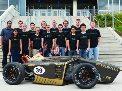 Waterloo Hybrid Engineering team with competition vehicle