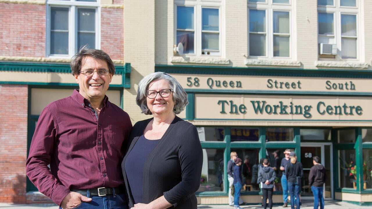 Joseph and Stephanie Mancini stand outside The Working Centre