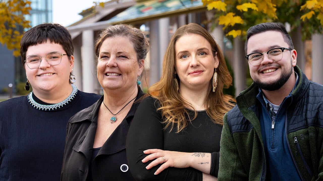 Tara Ryan, Dale Bellaire, Savannah Sloat and Kian Drew pose in front of the Indigenous Outdoor Gathering Space.