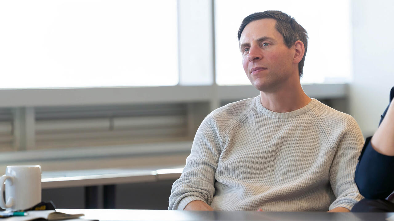 Dr. Doug Kavanagh listens intently during a presentation 