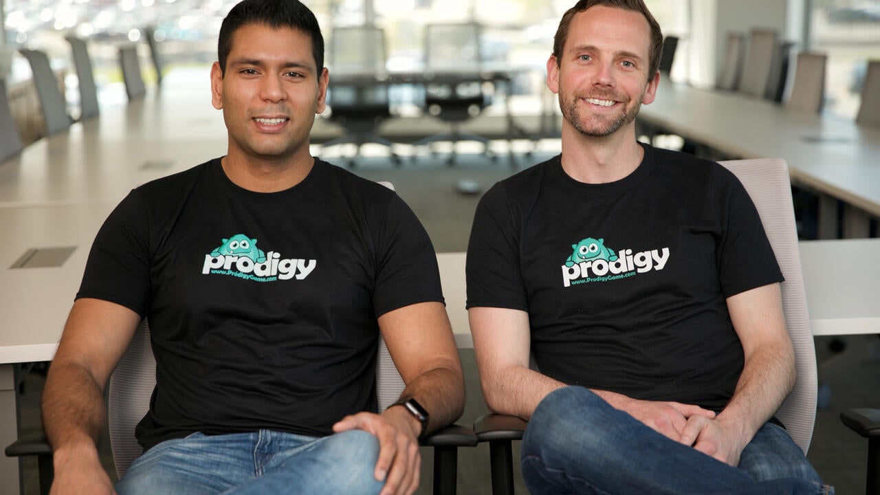 Rohan Mahimker (BASc ’11) and Alexander Peters (BASc ’11) sitting together and wearing Prodigy t-shirts