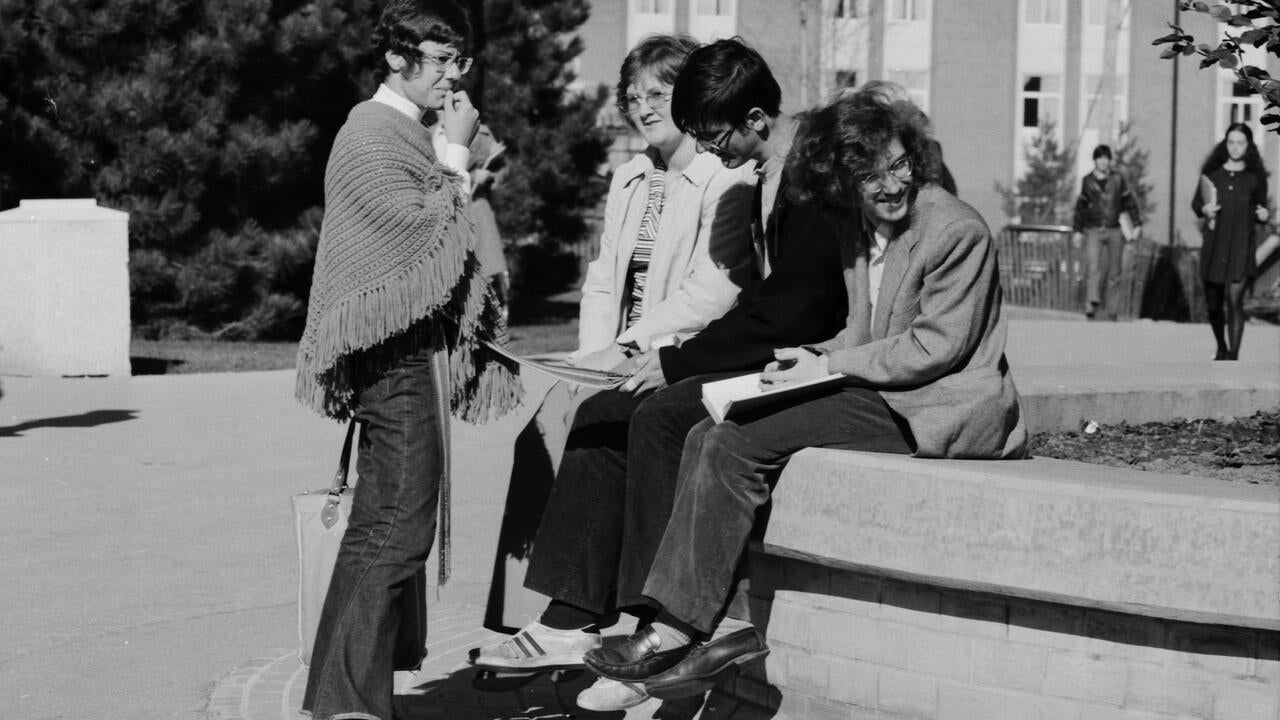 Students sit in the Arts quad, circa 1971