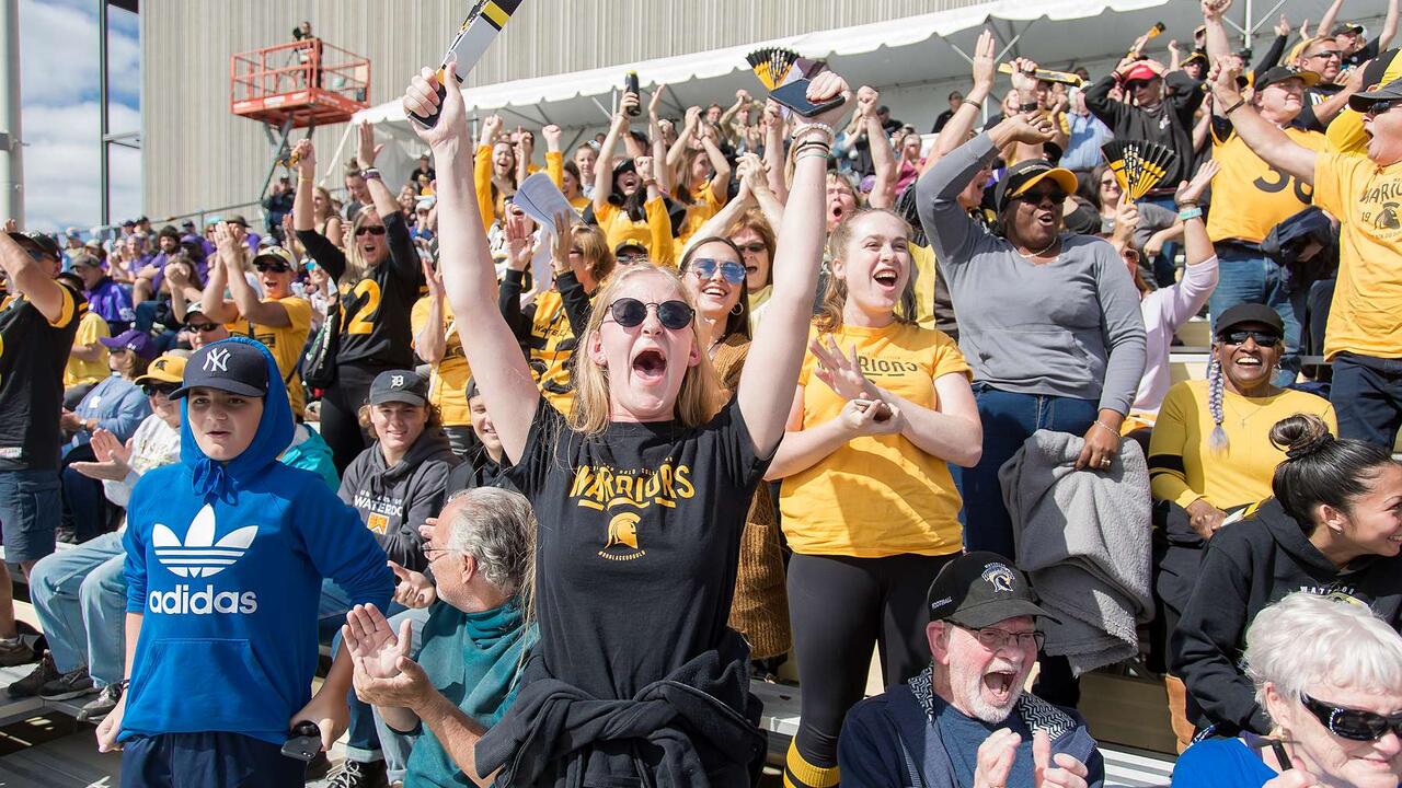 students watching football