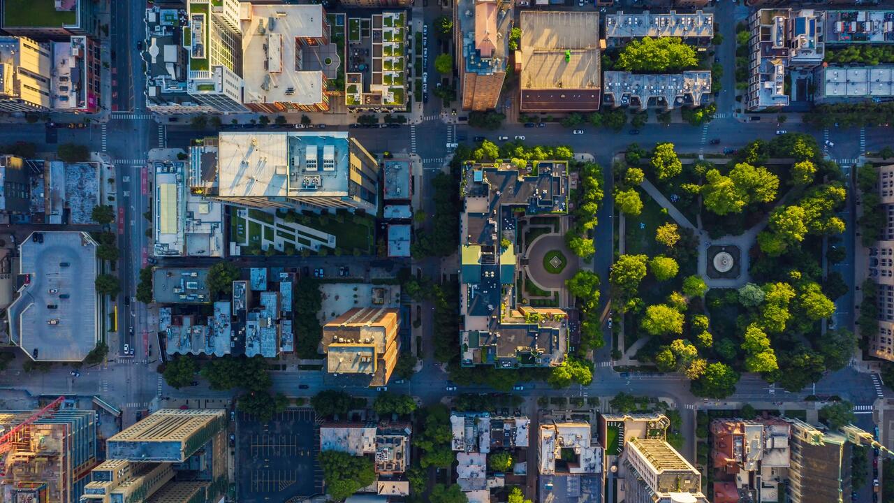Top-down view of an urban neighbourhood with high- and low-rise buildings and green space