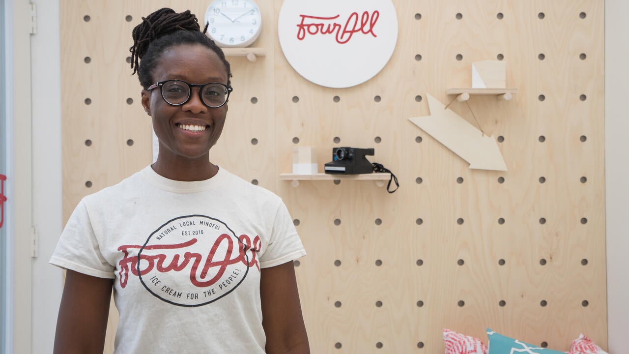 Ajoah Minath standing in her ice cream store