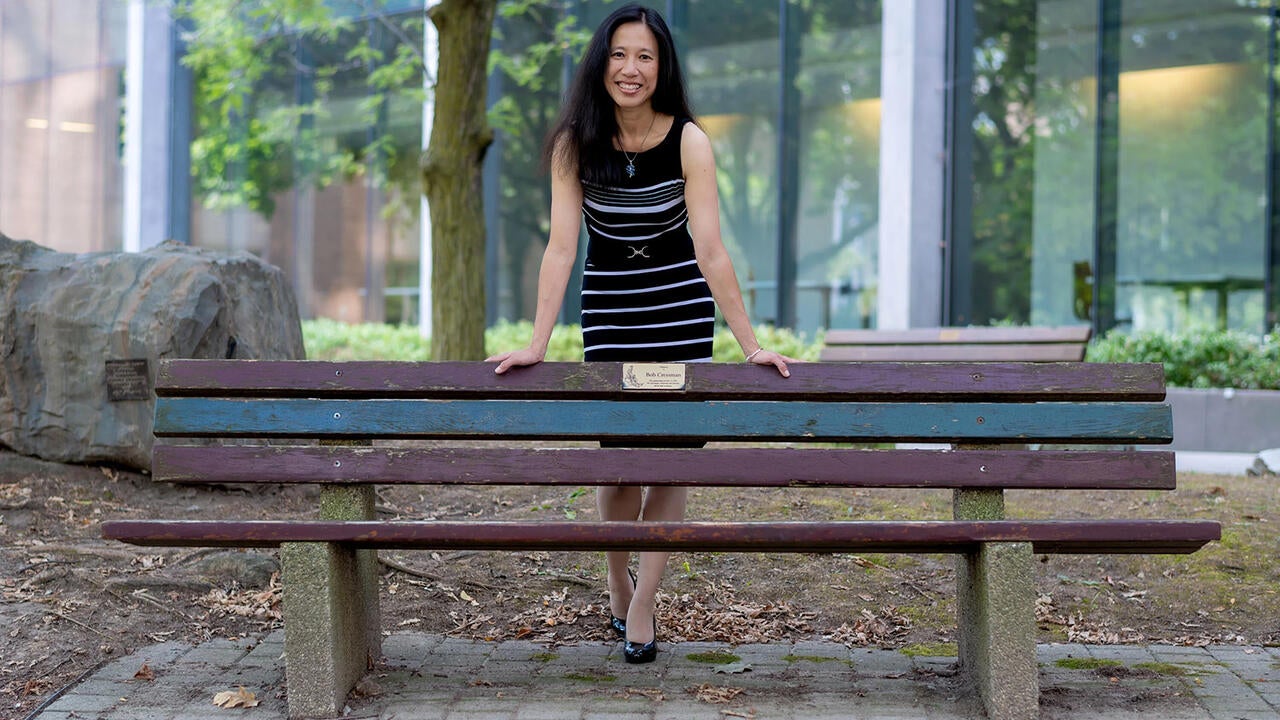 Anita Layton standing behind a bench
