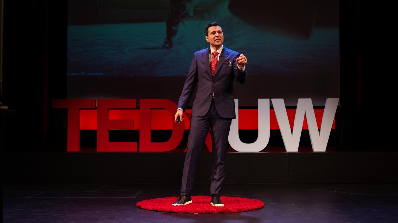Arda Ocal speaks at the TEDxUW conference