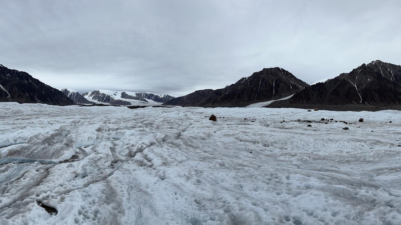 glacier with mountains in the distance