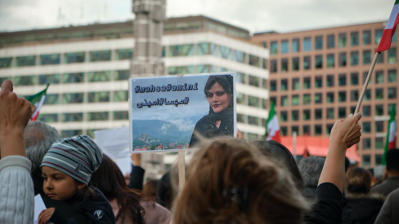 Crowd of people protesting the death of Jina Mahsa Amini