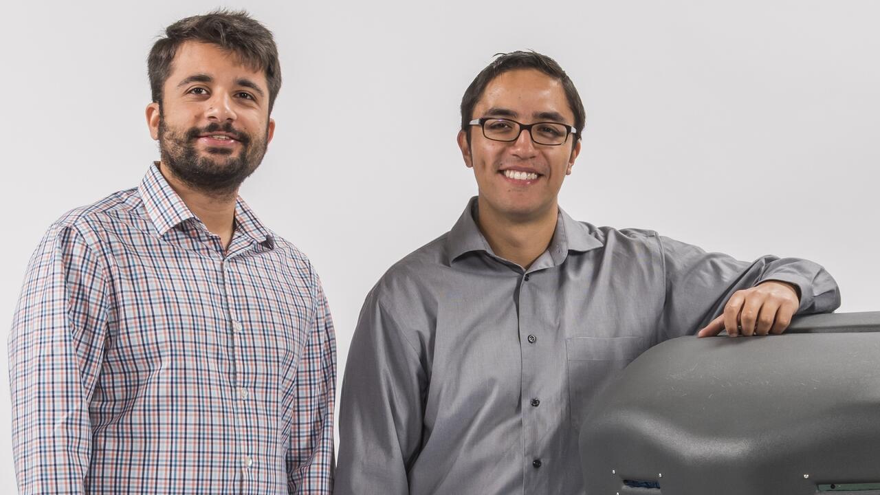 Avidbots founders Pablo Molina and Faizan Sheikh beside Neo