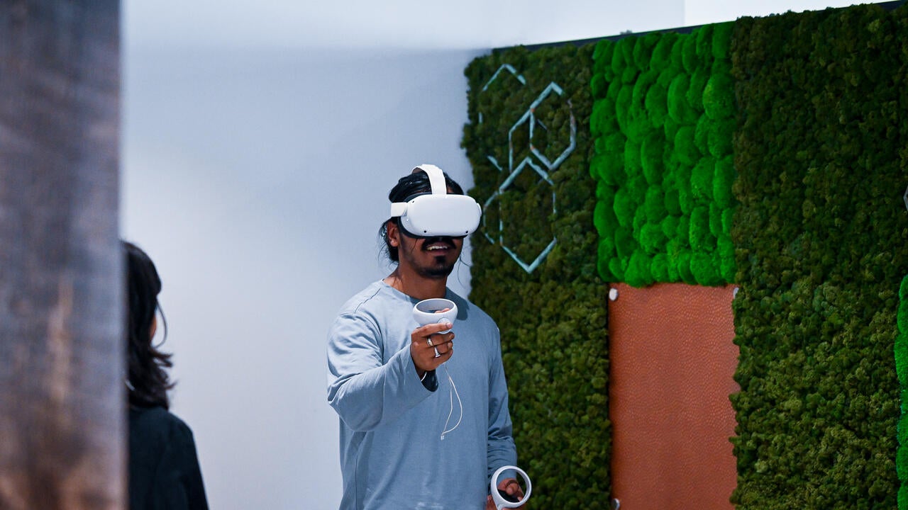 male student using a VR headset