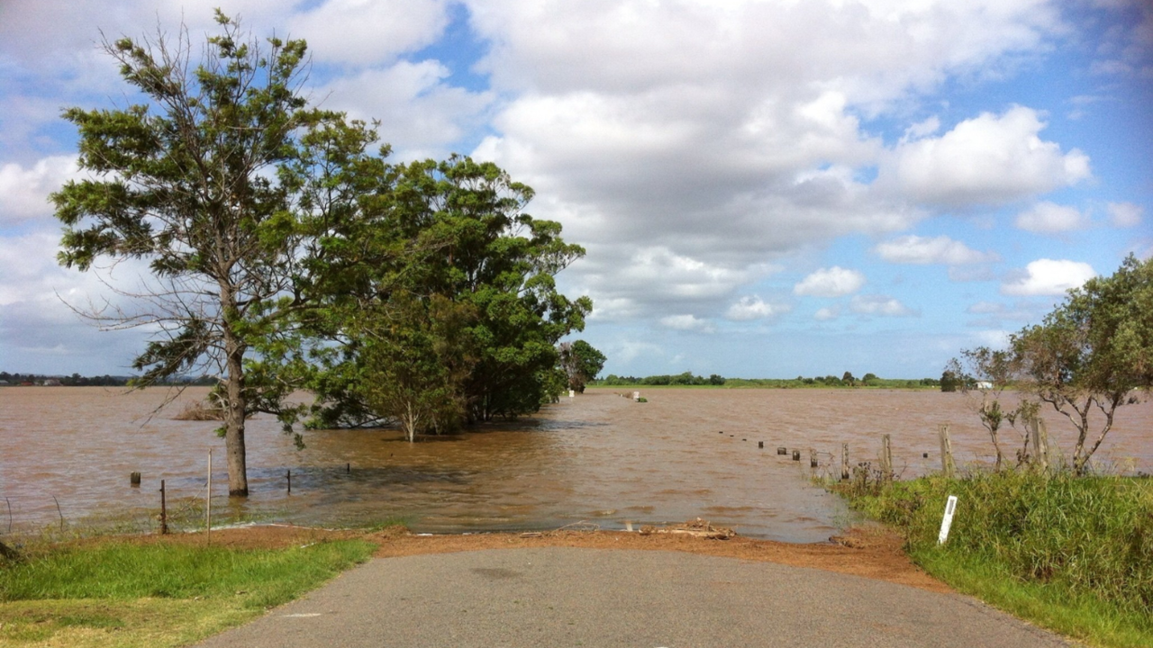 Flooded river valley and trees under water