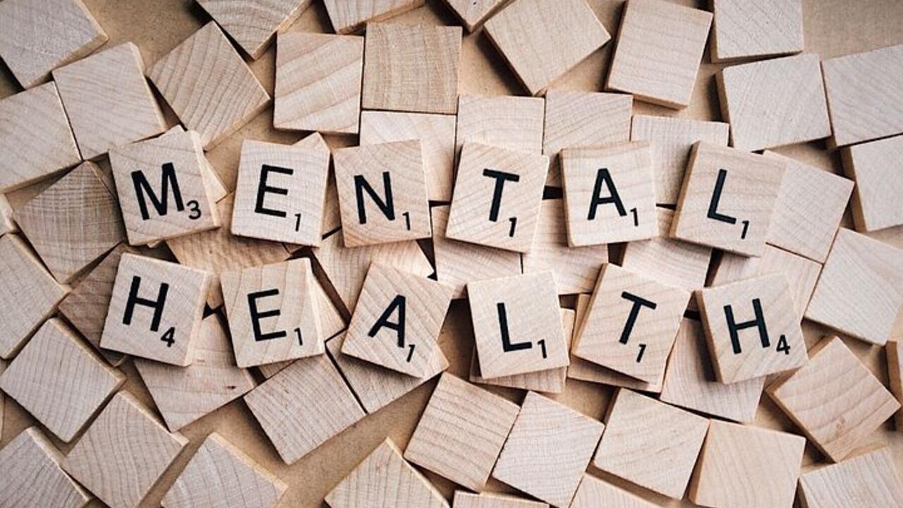 Scrabble tiles spell out mental health