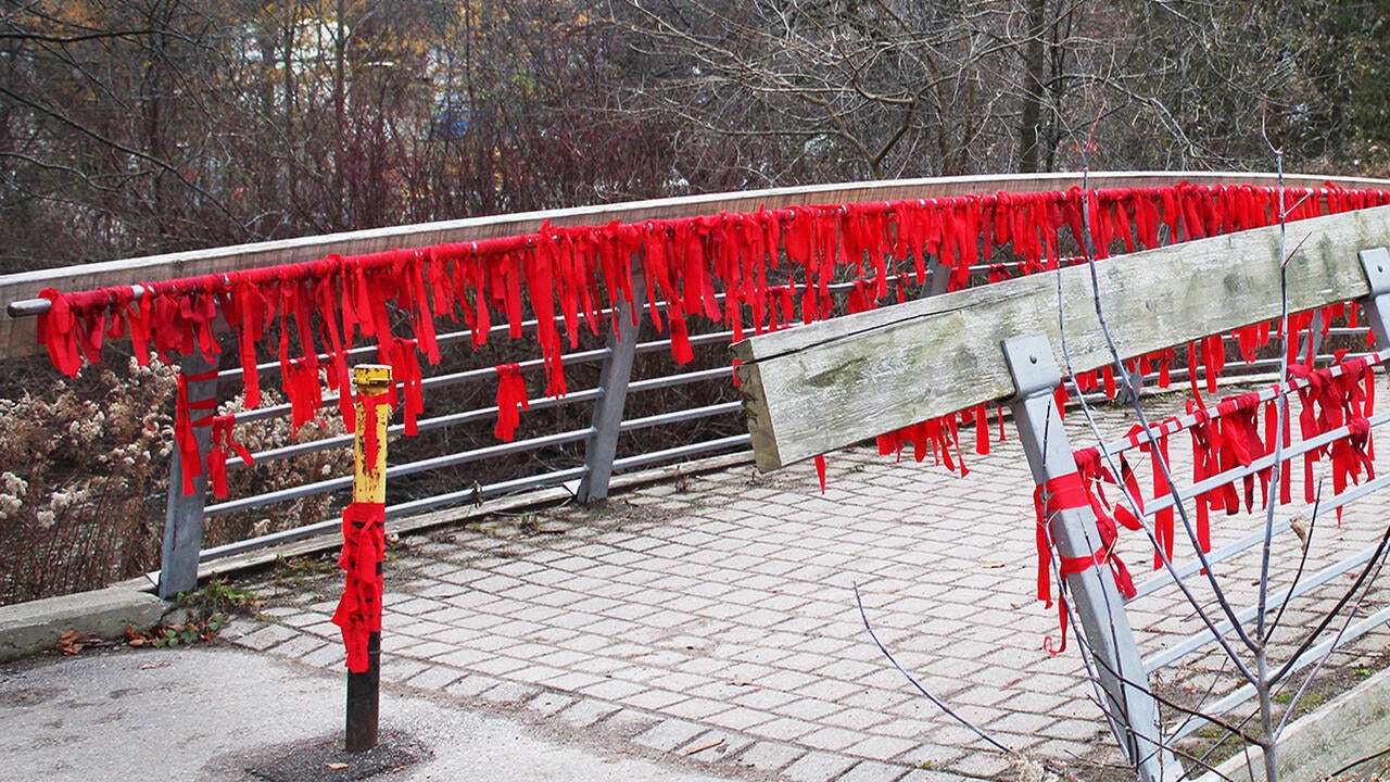 Bridge with red ribbons to represent missing and murdered Indiginous women