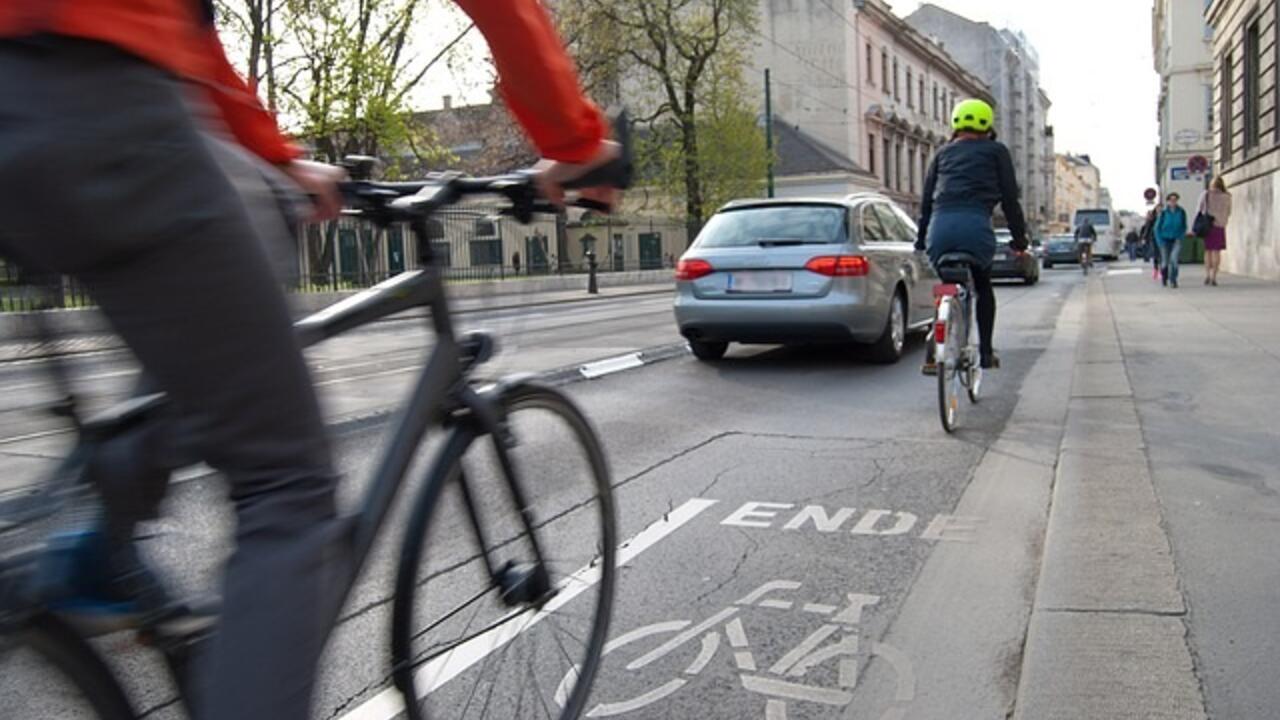 Bikers cycling down a bike lane in Uptown Waterloo