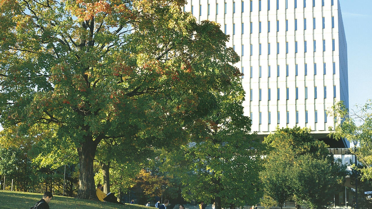 A photo of students walking by Dana Porter Library