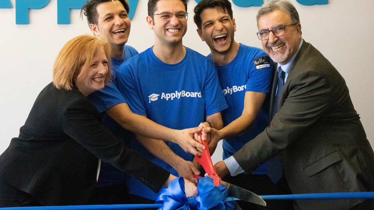 Feridun cutting the ribbon at ApplyBoard