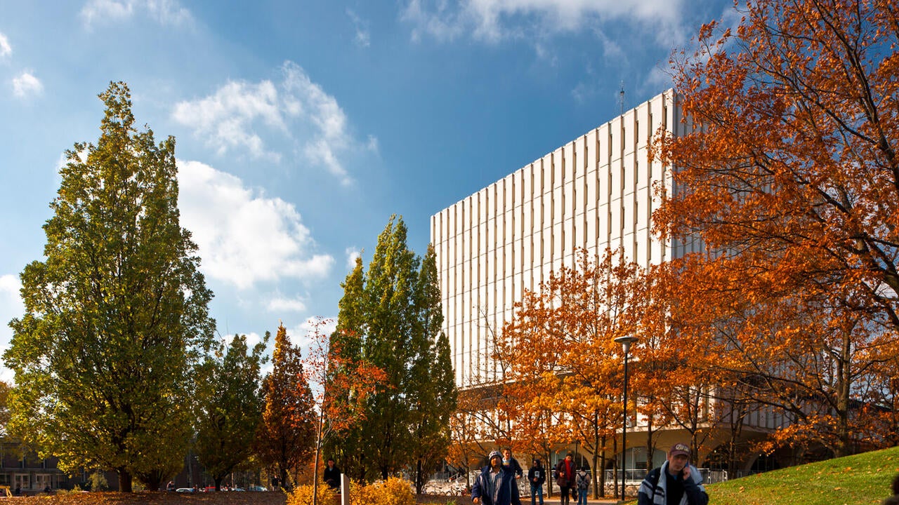 Dana Porter Library in the fall term with students walking in the front