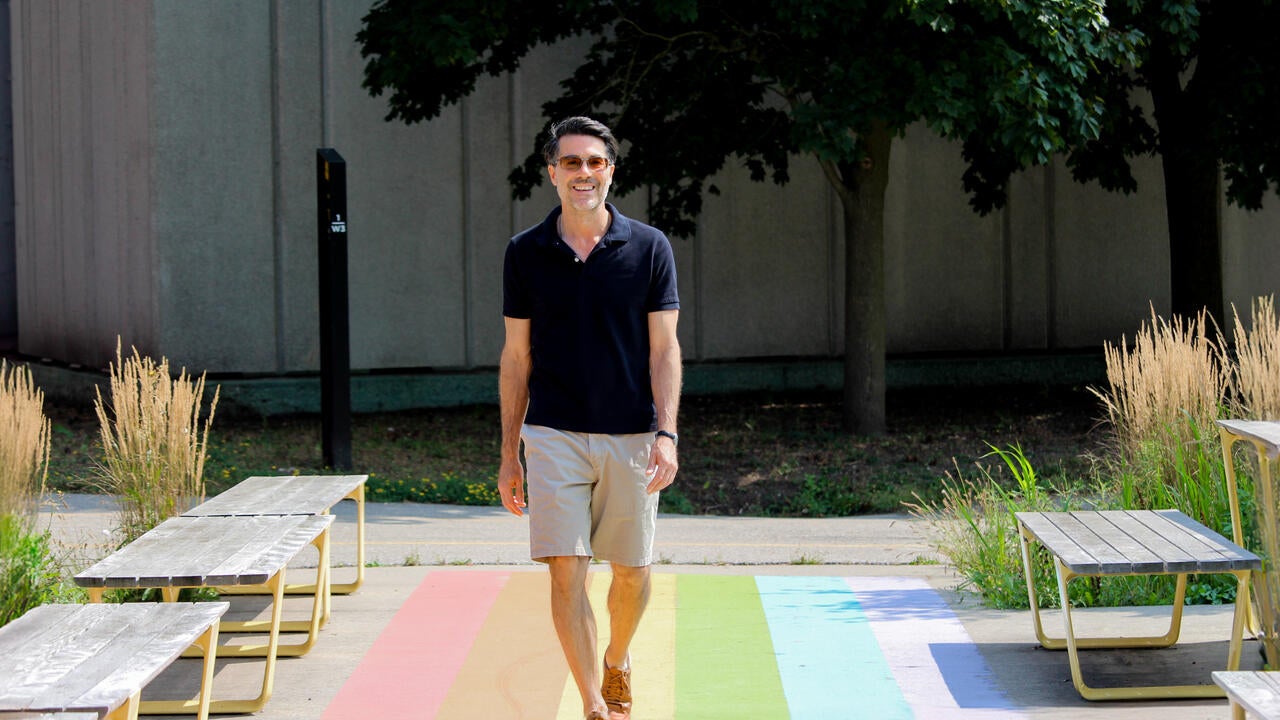 Dr. Brian Oren walks down a path at the University of Waterloo 