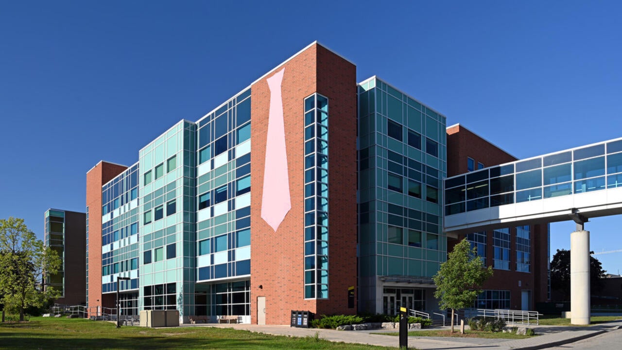 A pink tie hangs from the Mathematics 3 building