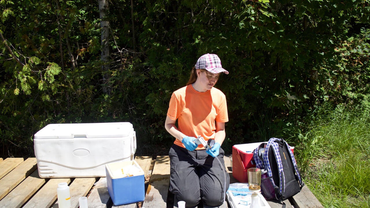 Ellen Cameron collecting water samples