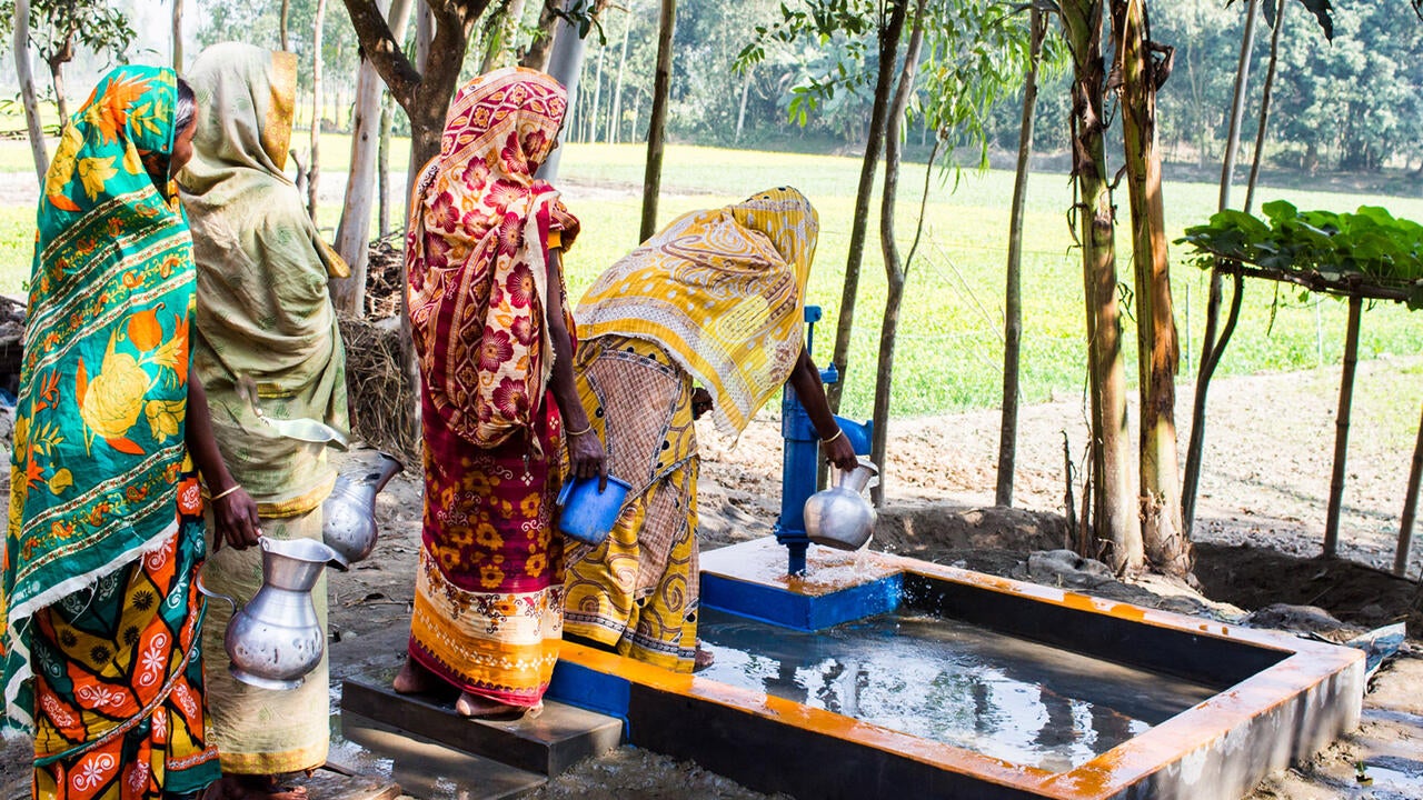 Water pump being used by women in Bangladesh
