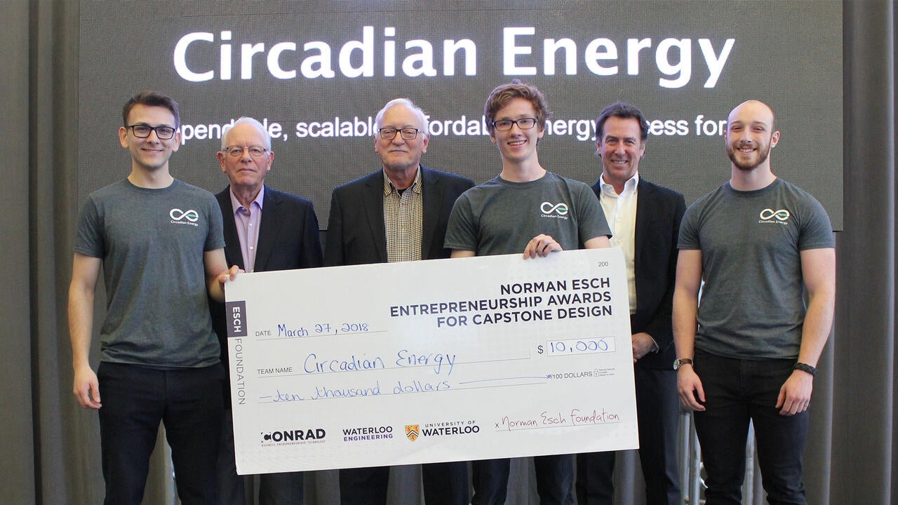 Circadian winners stand smiling with their $10,000 cheque.