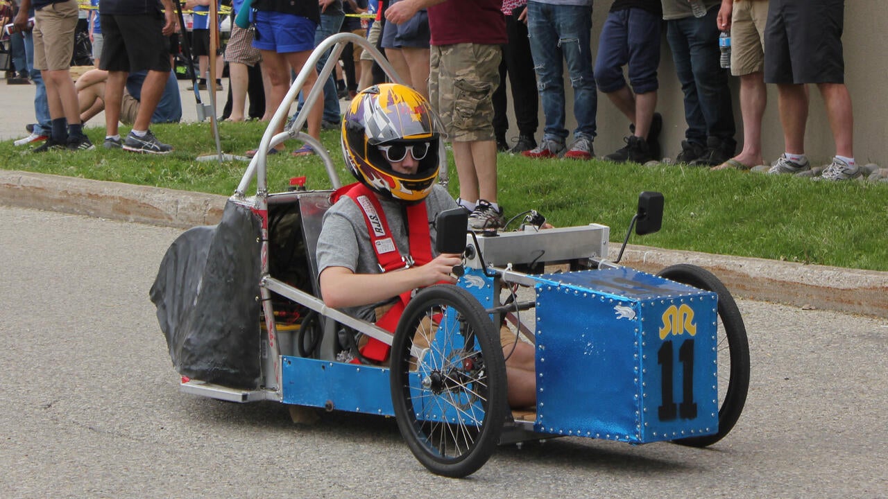 Competitor riding in a small electric race-car