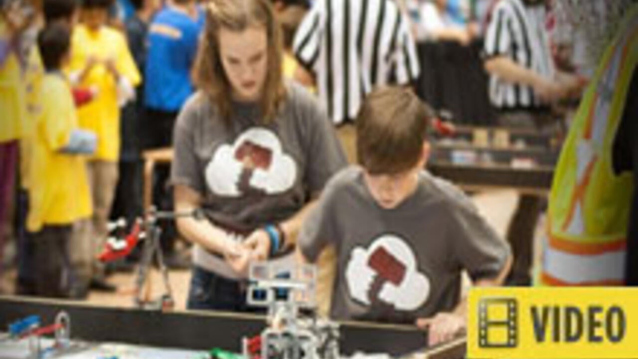 Kids working on small robots