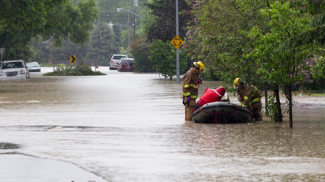 rescuers save people from flood