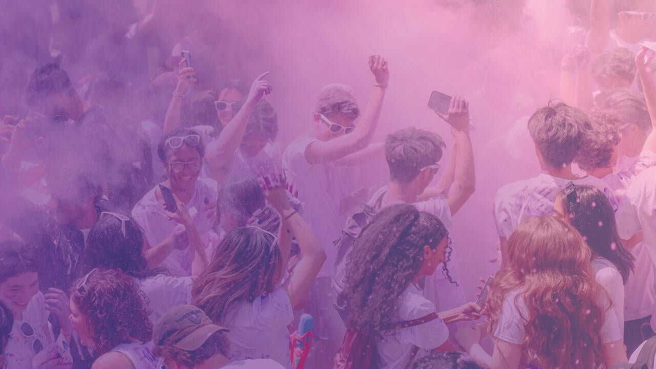 Engineering students celebrating with purple fog