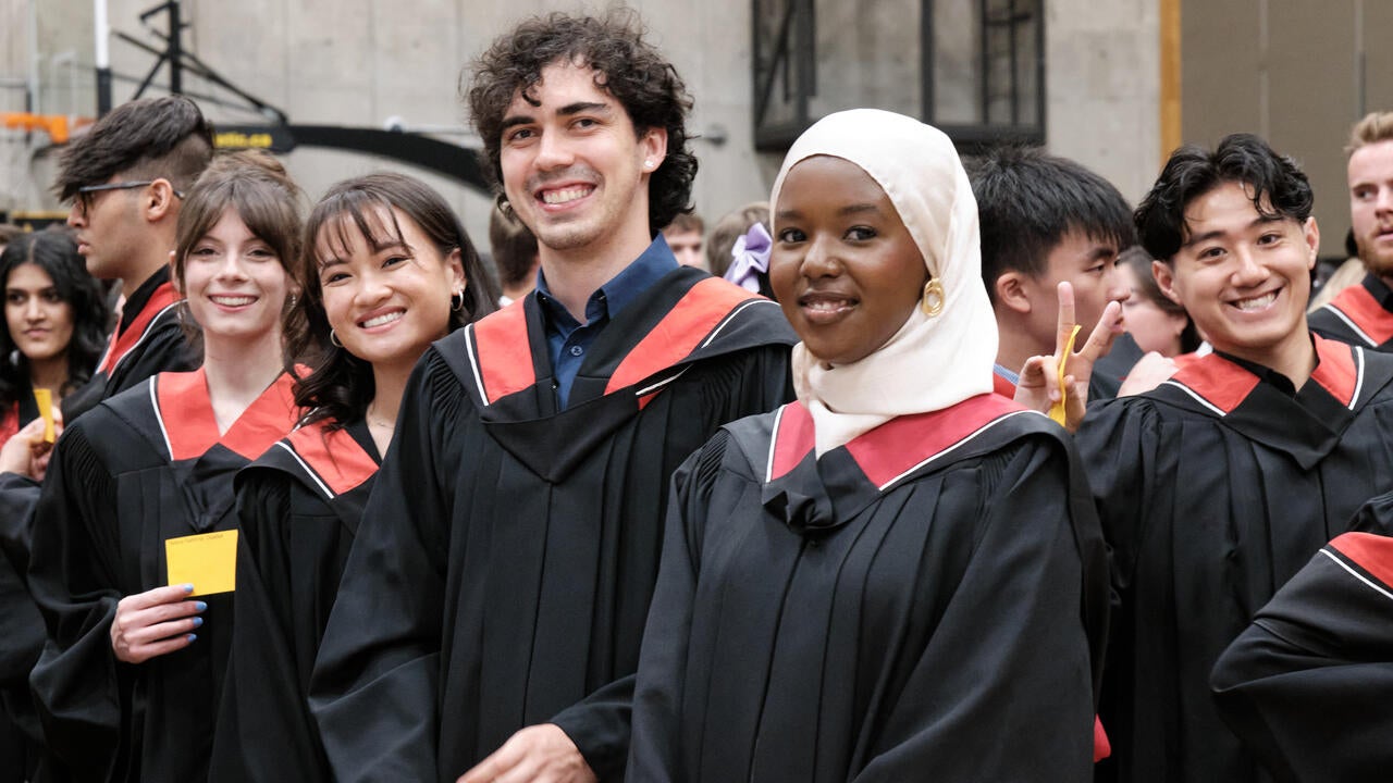New graduates pose after convocation