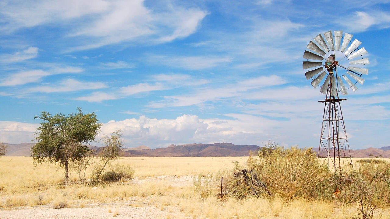 Field in Gambia with a wind turbine