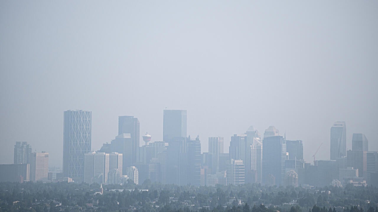Downtown Calgary city street covered with smoke from forest fires