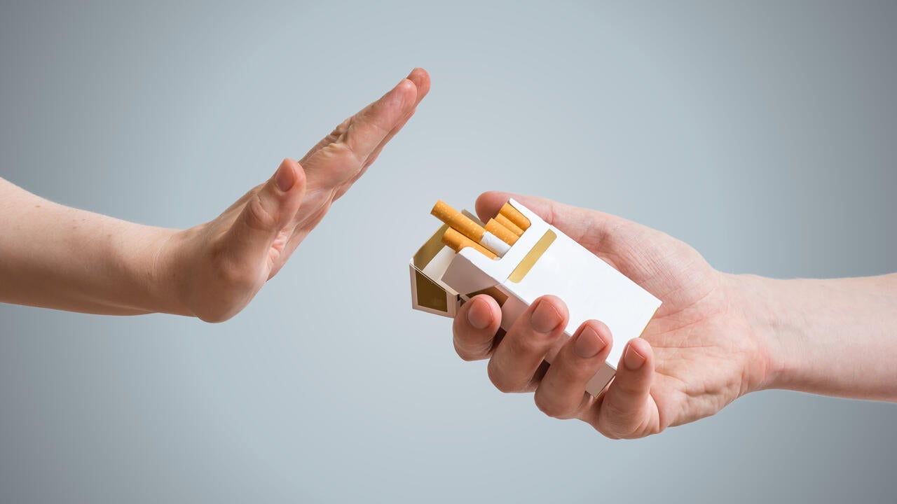 Hand is refusing cigarette offer.