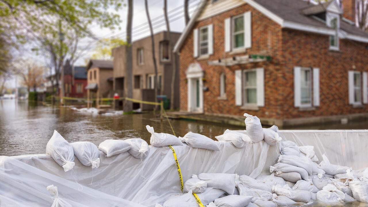 Extreme flooding in a neighborhood with sandbags used as blockage 