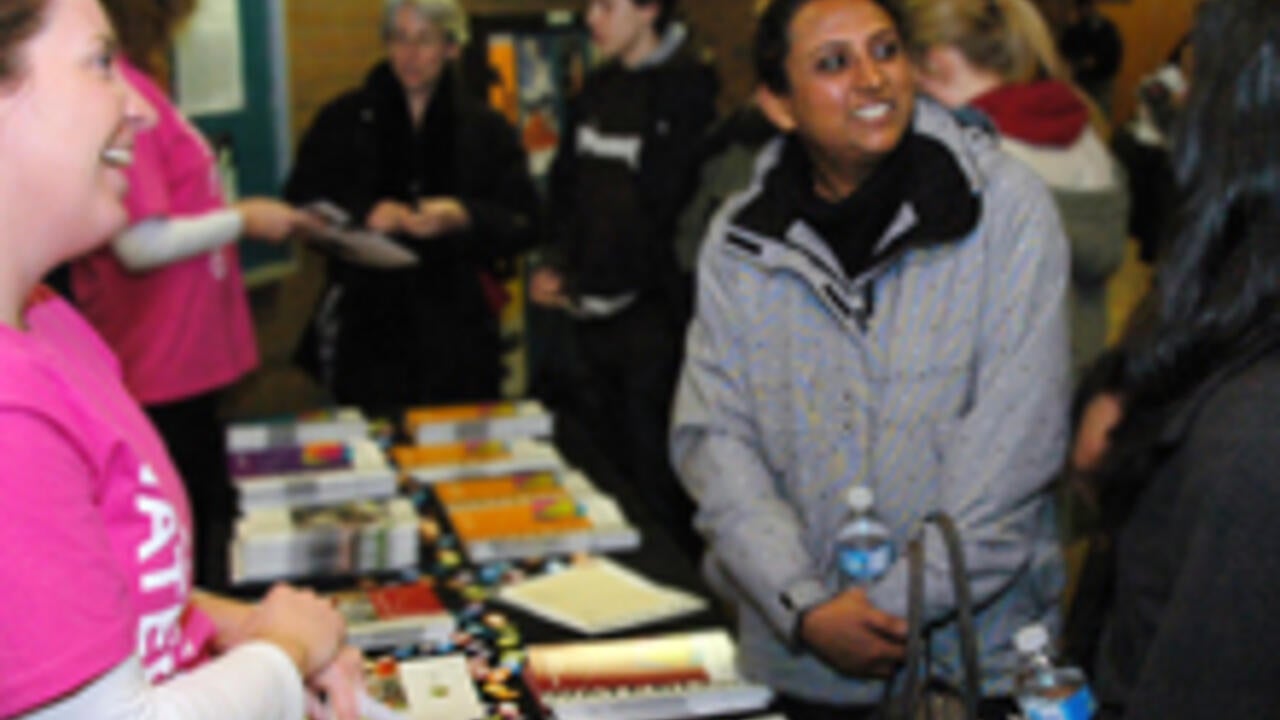 Prospective students engage with family night volunteers at Waterloo