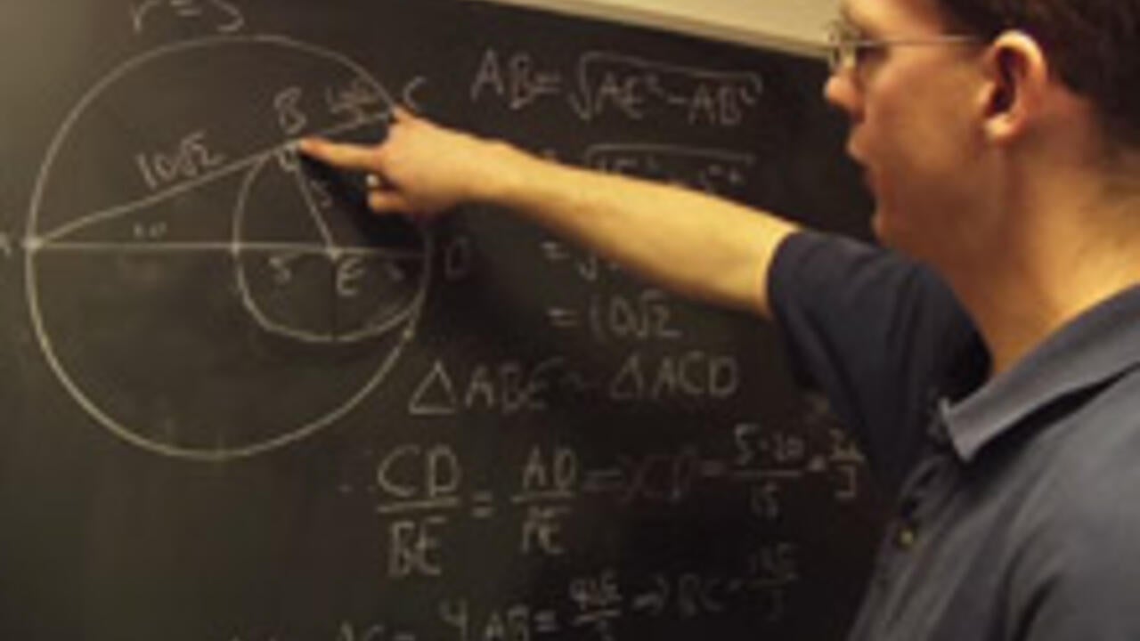 Lecturer Ian VanderBurgh teaching math