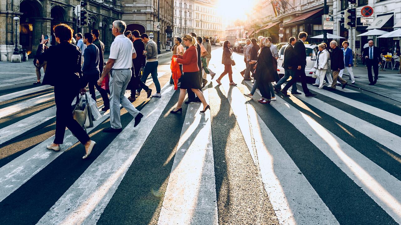 People crossing street in Vienna, Austria