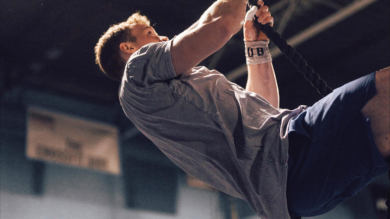 Jack Farlow climbing a rope