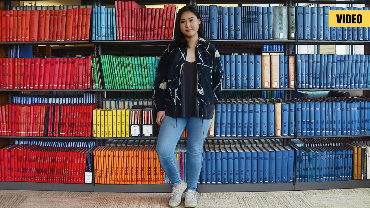 Kathleen Fu in front of architecture books