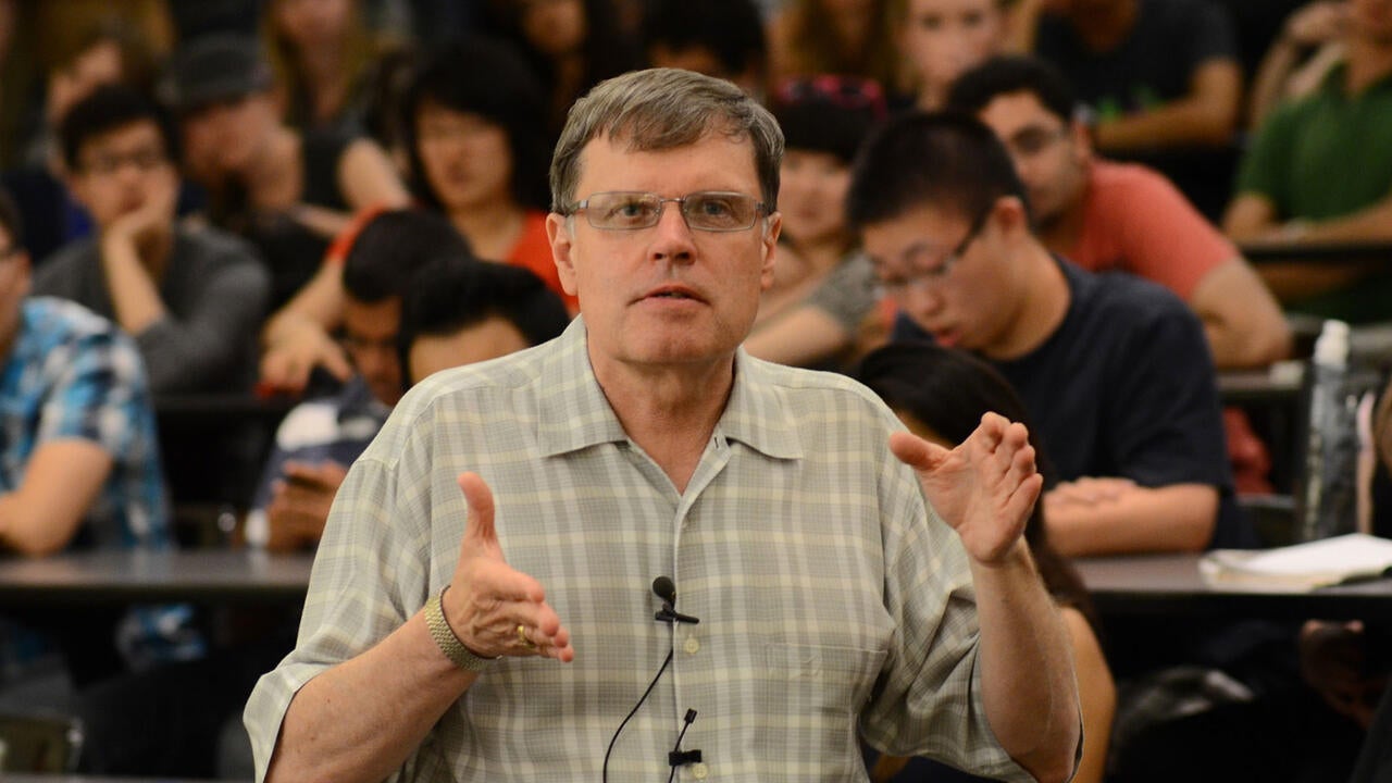 Larry Smith speaking at a lecture