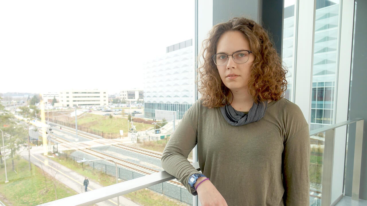 Leah Kristufek standing at window